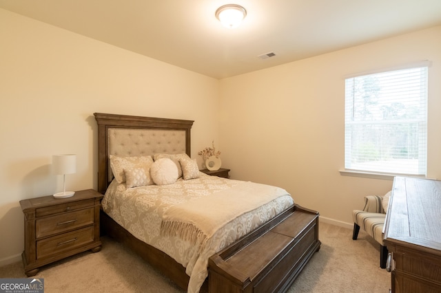 1800 Pearson St, Loganville, GA 30052 - bedroom with light carpet, baseboards, and visible vents