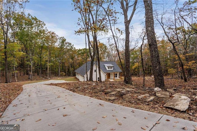 119 Acerose Dr, Jasper, GA 30143 - view of home's exterior featuring concrete driveway and a forest view