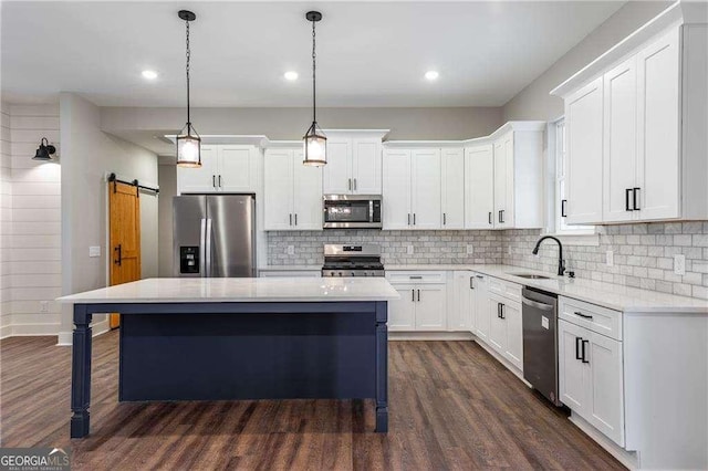 119 Acerose Dr, Jasper, GA 30143 - kitchen featuring appliances with stainless steel finishes, a center island, dark wood finished floors, white cabinetry, and recessed lighting