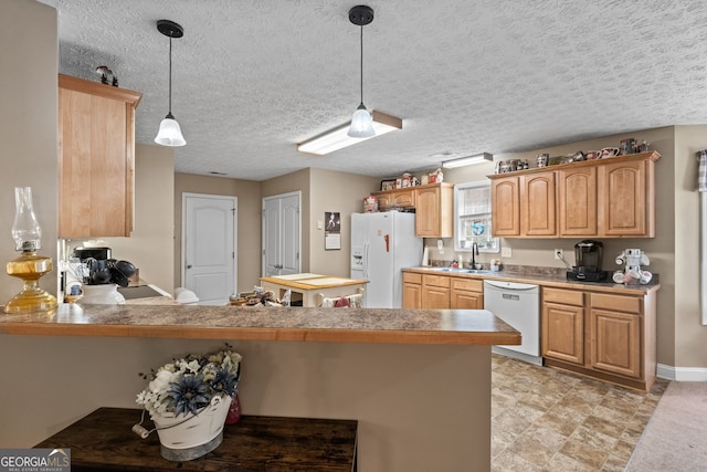 575 Chuli Rd, Locust Grove, GA 30248 - kitchen with white appliances, a peninsula, pendant lighting, and light countertops