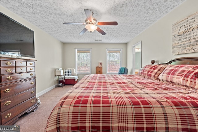 575 Chuli Rd, Locust Grove, GA 30248 - bedroom with carpet flooring, a textured ceiling, ceiling fan, and connected bathroom
