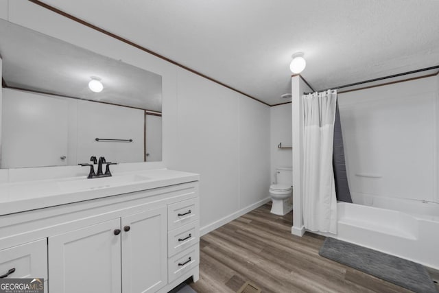 138 Forest Hill Dr, Eatonton, GA 31024 - full bathroom with shower / bathtub combination with curtain, toilet, vanity, and wood finished floors