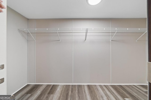138 Forest Hill Dr, Eatonton, GA 31024 - walk in closet with wood finished floors
