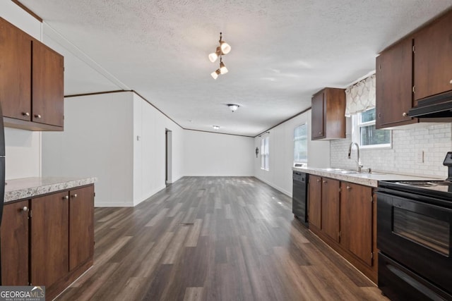 138 Forest Hill Dr, Eatonton, GA 31024 - kitchen featuring dark wood finished floors, black appliances, light countertops, and tasteful backsplash