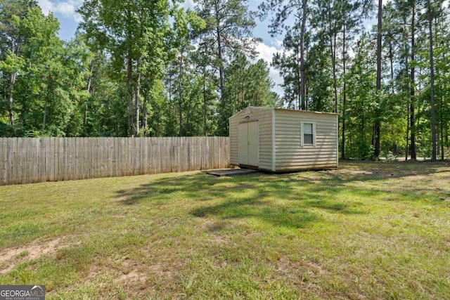 138 Forest Hill Dr, Eatonton, GA 31024 - view of yard featuring an outbuilding, fence, and a storage shed