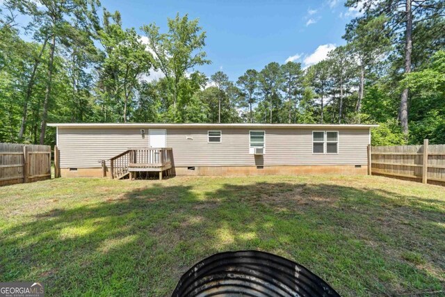 138 Forest Hill Dr, Eatonton, GA 31024 - rear view of property with fence, crawl space, and a yard