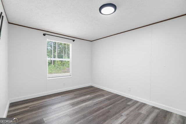 138 Forest Hill Dr, Eatonton, GA 31024 - spare room featuring baseboards, ornamental molding, and wood finished floors