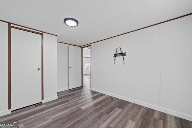138 Forest Hill Dr, Eatonton, GA 31024 - unfurnished bedroom with wood finished floors