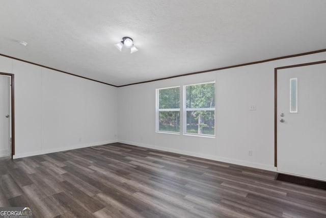 138 Forest Hill Dr, Eatonton, GA 31024 - spare room with crown molding, baseboards, and dark wood finished floors