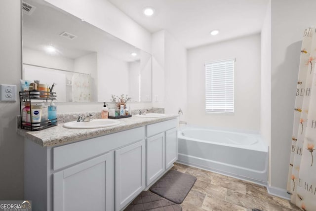 138 Brode Ln, Pendergrass, GA 30567 - bathroom with a sink, a bath, and visible vents