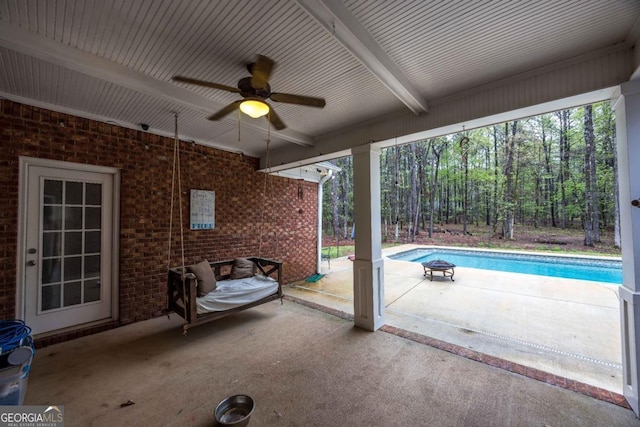 view of patio / terrace featuring an outdoor pool and ceiling fan