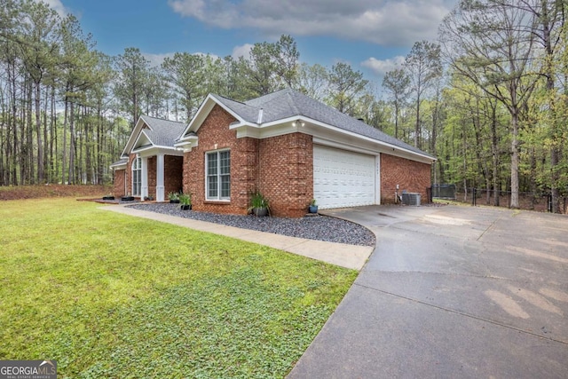 view of front of home with cooling unit, a front lawn, brick siding, an attached garage, and concrete driveway