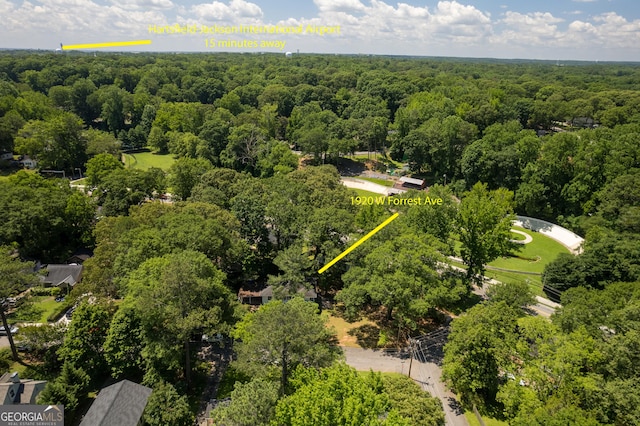drone / aerial view featuring a forest view