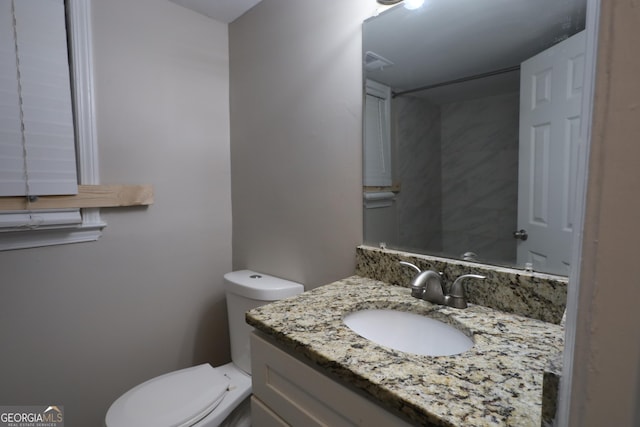 4044 Lindsey Dr, Decatur, GA 30035 - bathroom featuring toilet, vanity, and visible vents