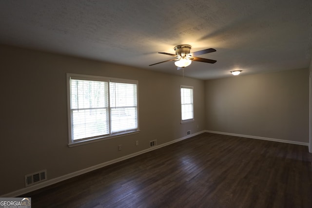 4044 Lindsey Dr, Decatur, GA 30035 - spare room with baseboards, visible vents, dark wood-style flooring, and a ceiling fan