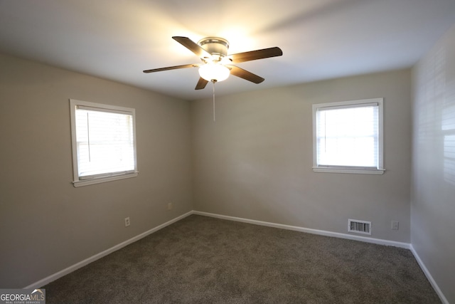 4044 Lindsey Dr, Decatur, GA 30035 - spare room featuring baseboards, dark colored carpet, ceiling fan, and visible vents