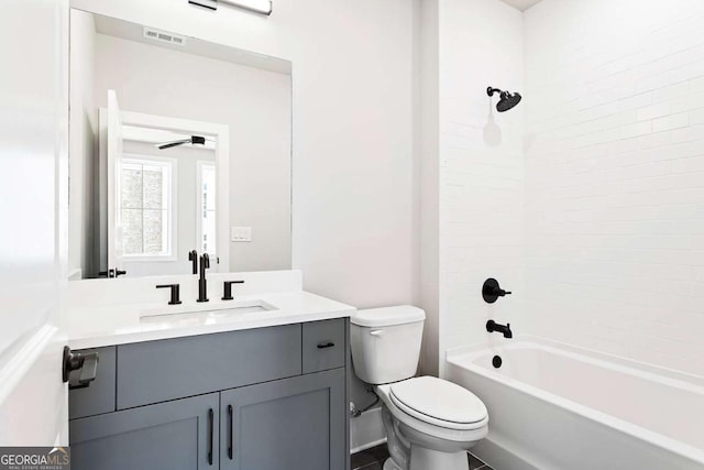 full bath with toilet, vanity, and shower / washtub combination