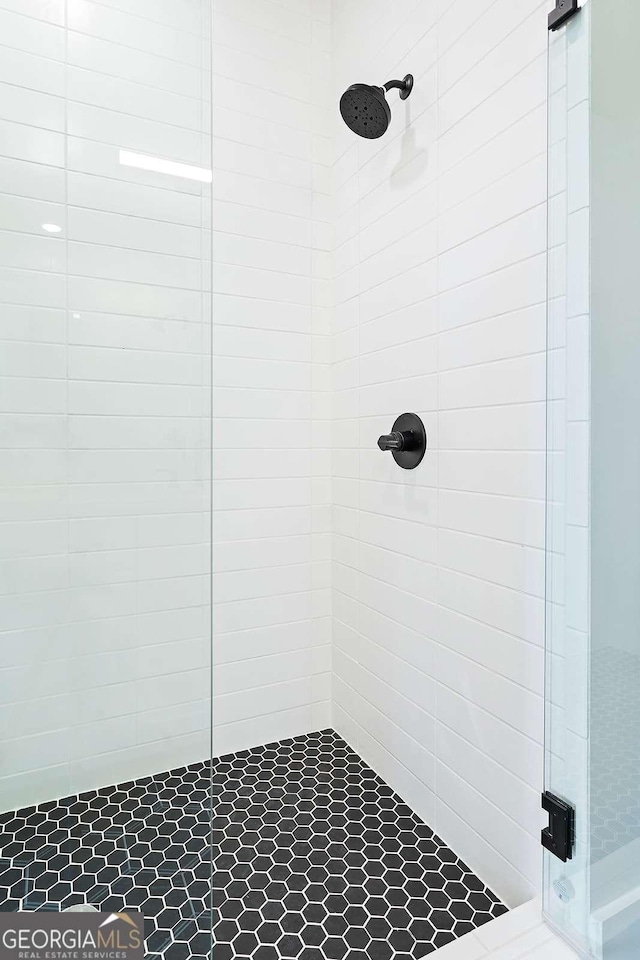 bathroom with a shower stall