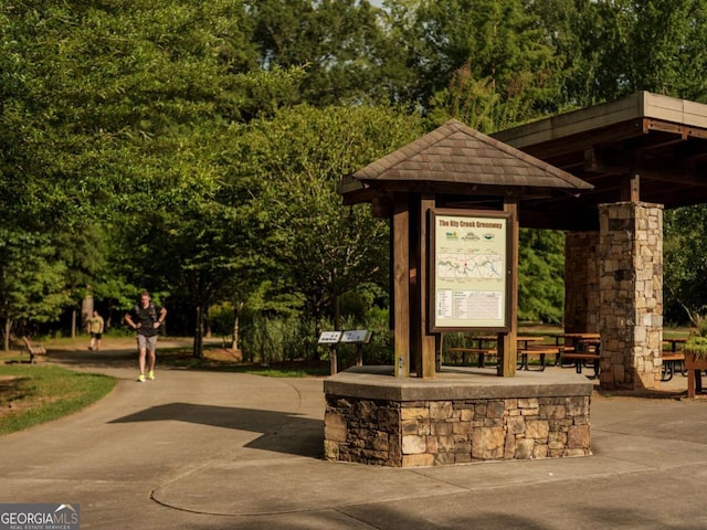 view of home's community featuring view of wooded area and a gazebo