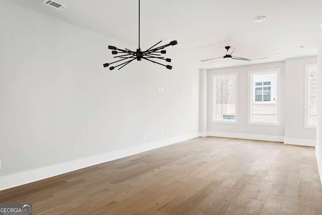 empty room with wood finished floors and baseboards
