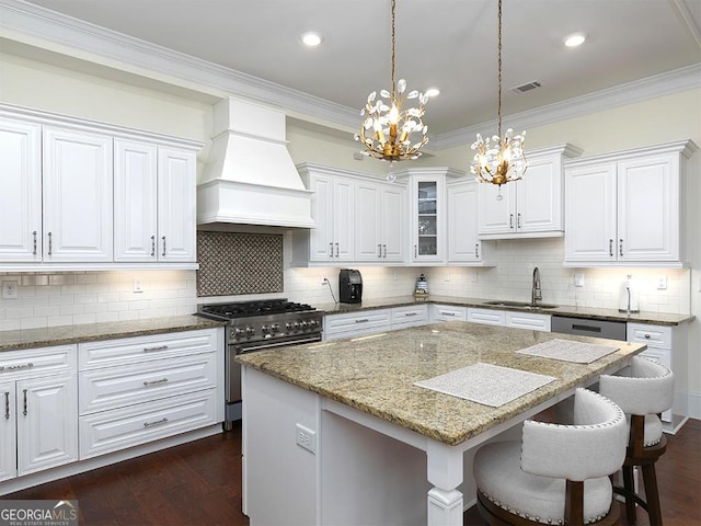 4845 Josie Way NW, Acworth, GA 30101 - kitchen with a sink, premium range hood, high end range, visible vents, and an inviting chandelier