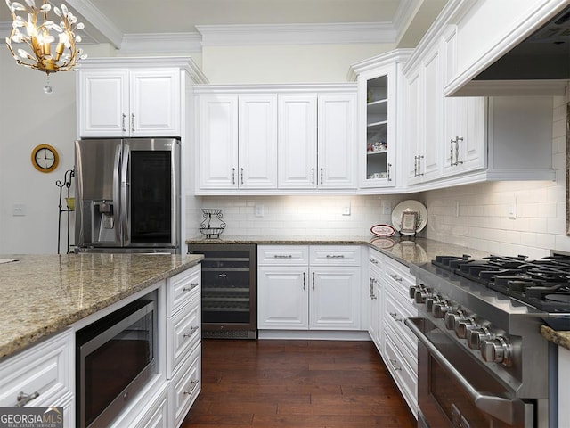 4845 Josie Way NW, Acworth, GA 30101 - kitchen featuring ornamental molding, stainless steel appliances, premium range hood, and beverage cooler