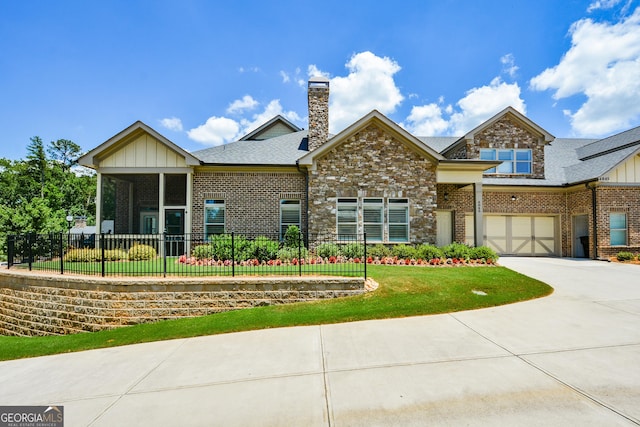 4845 Josie Way NW, Acworth, GA 30101 - view of front of home featuring a front yard, concrete driveway, an attached garage, fence, and brick siding