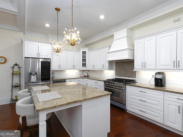 4845 Josie Way NW, Acworth, GA 30101 - kitchen with premium range hood, a center island, dark wood finished floors, a notable chandelier, and appliances with stainless steel finishes