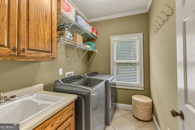2323 Council Ln, Buford, GA 30519 - washroom featuring washer and dryer, cabinet space, ornamental molding, and light tile patterned floors