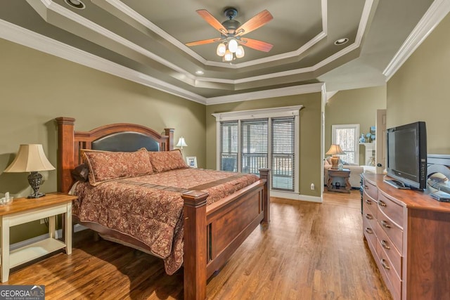 2323 Council Ln, Buford, GA 30519 - bedroom with a tray ceiling, ornamental molding, wood finished floors, and ceiling fan