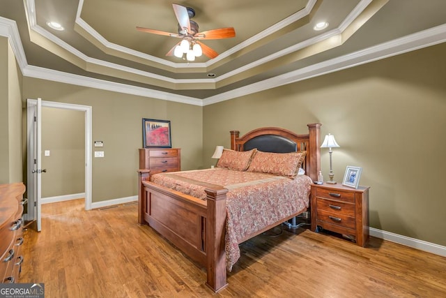 2323 Council Ln, Buford, GA 30519 - bedroom with a tray ceiling, ornamental molding, light wood-style floors, and ceiling fan