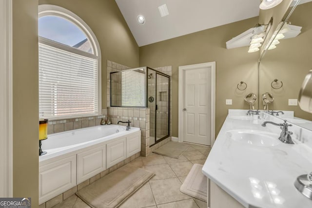 2323 Council Ln, Buford, GA 30519 - bathroom featuring a bath, a shower stall, plenty of natural light, double vanity, and vaulted ceiling