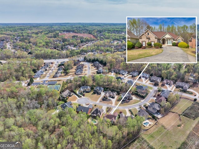 birds eye view of property with a residential view
