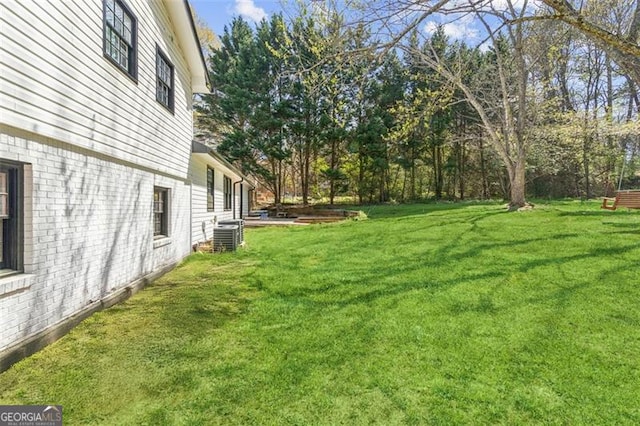view of yard with central AC
