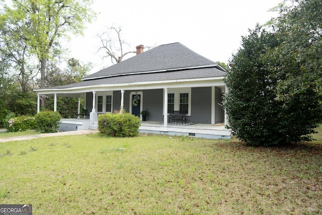 rear view of house with a chimney, crawl space, roof with shingles, a porch, and a yard