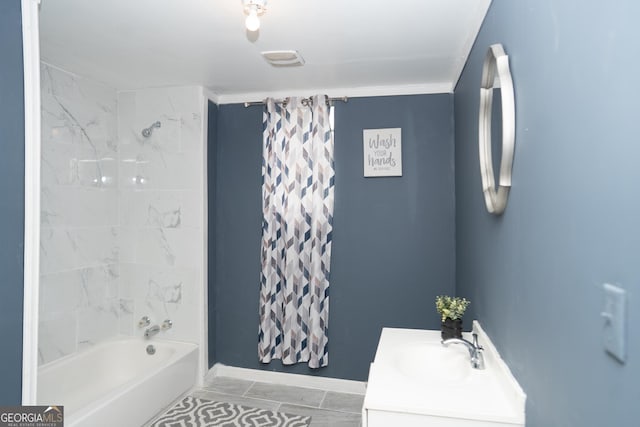 full bathroom featuring vanity, shower / bath combo, and baseboards