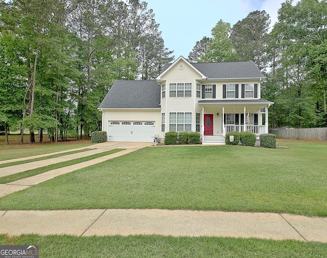 colonial house featuring a front lawn, an attached garage, fence, concrete driveway, and a porch