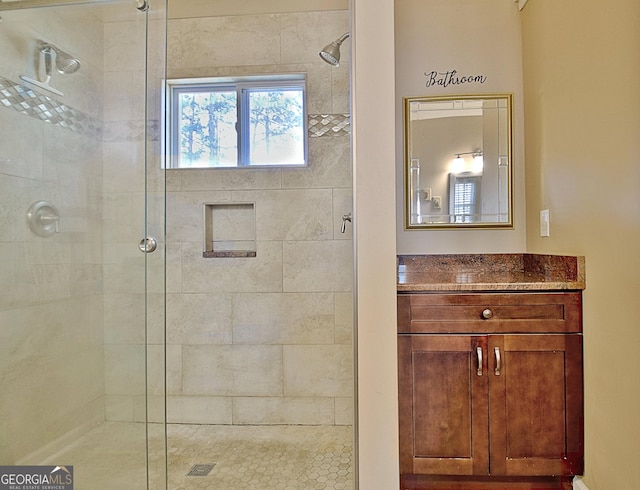 bathroom with vanity and a stall shower