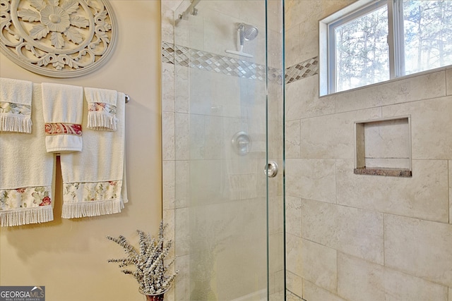 bathroom with a shower stall