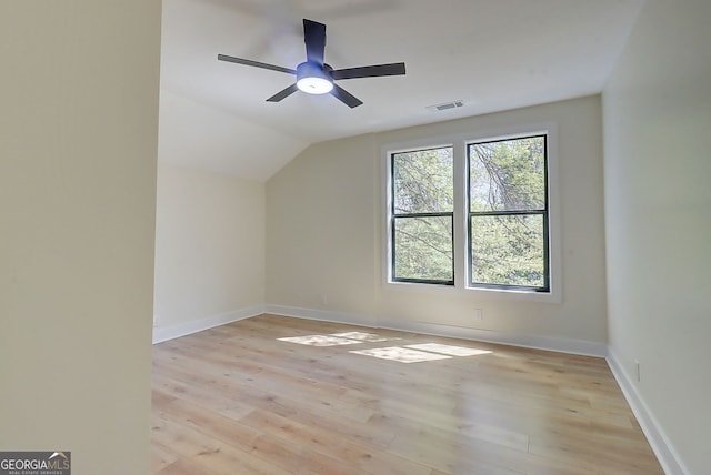 bonus room with visible vents, light wood finished floors, baseboards, ceiling fan, and lofted ceiling