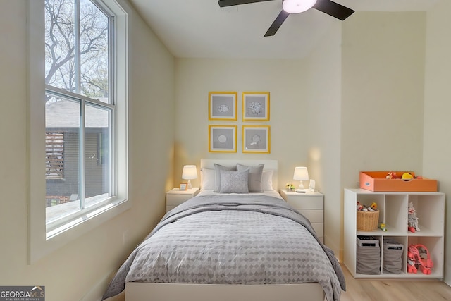bedroom with wood finished floors and ceiling fan