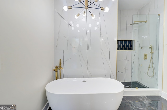 bathroom with a soaking tub, an inviting chandelier, and a marble finish shower