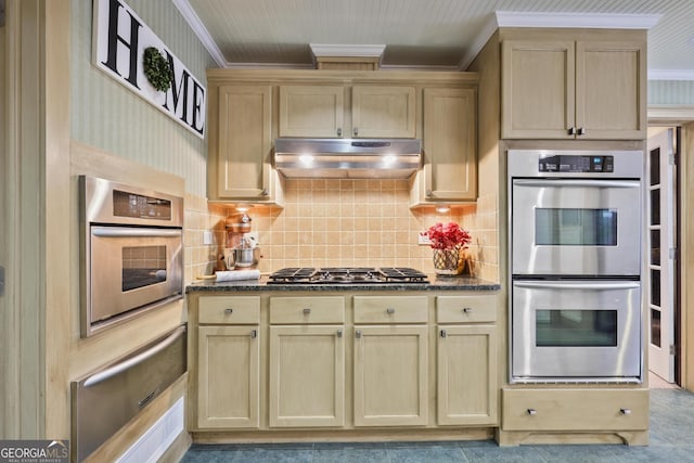 55 Hazelbrook Way, Acworth, GA 30101 - kitchen featuring crown molding, dark stone counters, stainless steel appliances, under cabinet range hood, and a warming drawer
