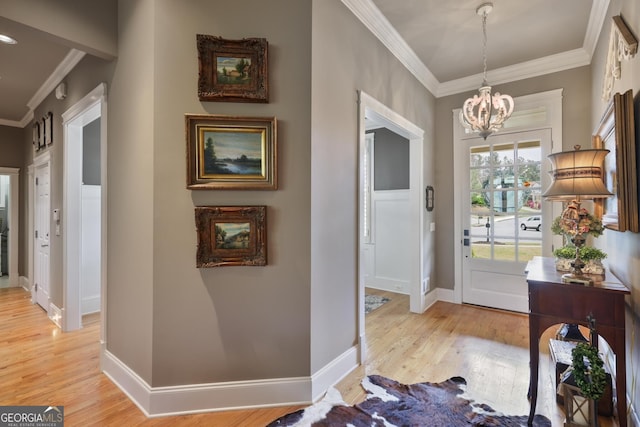 55 Hazelbrook Way, Acworth, GA 30101 - entryway with ornamental molding, baseboards, light wood-style floors, and a notable chandelier