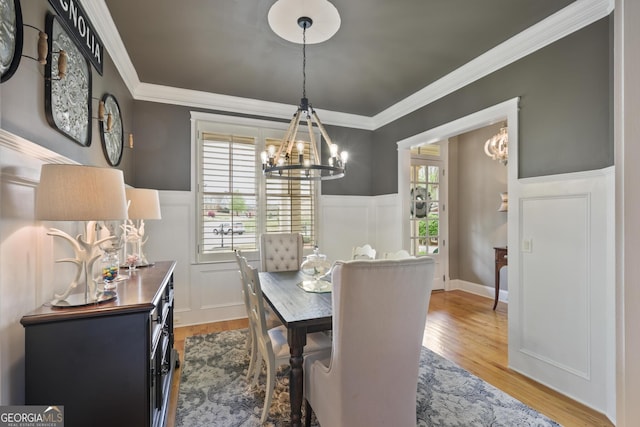 55 Hazelbrook Way, Acworth, GA 30101 - dining space featuring a healthy amount of sunlight, crown molding, and a chandelier