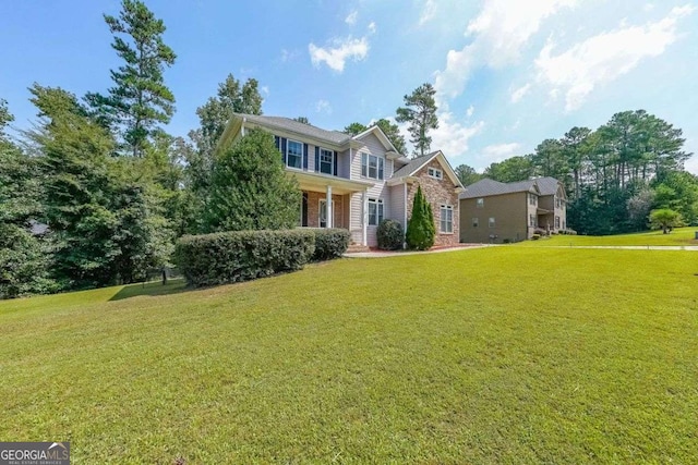 4408 Meadowwood Dr, Loganville, GA 30052 - colonial home featuring a front lawn and brick siding