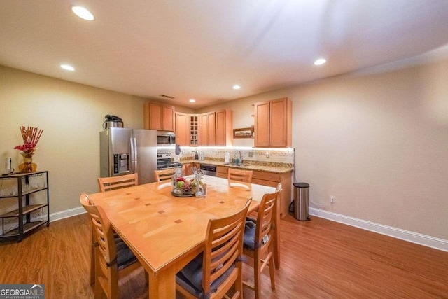 4408 Meadowwood Dr, Loganville, GA 30052 - dining room featuring recessed lighting, baseboards, and wood finished floors