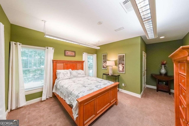 4408 Meadowwood Dr, Loganville, GA 30052 - bedroom featuring baseboards, visible vents, and light carpet