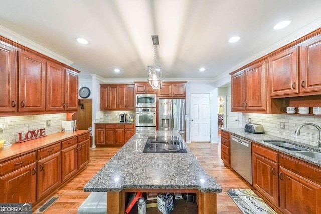 4408 Meadowwood Dr, Loganville, GA 30052 - kitchen featuring crown molding, a sink, open shelves, light wood-style flooring, and stainless steel appliances