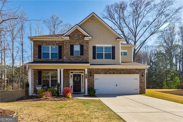 4870 Odum View Ln, Cumming, GA 30040 - craftsman-style home featuring a garage, a front lawn, driveway, and brick siding